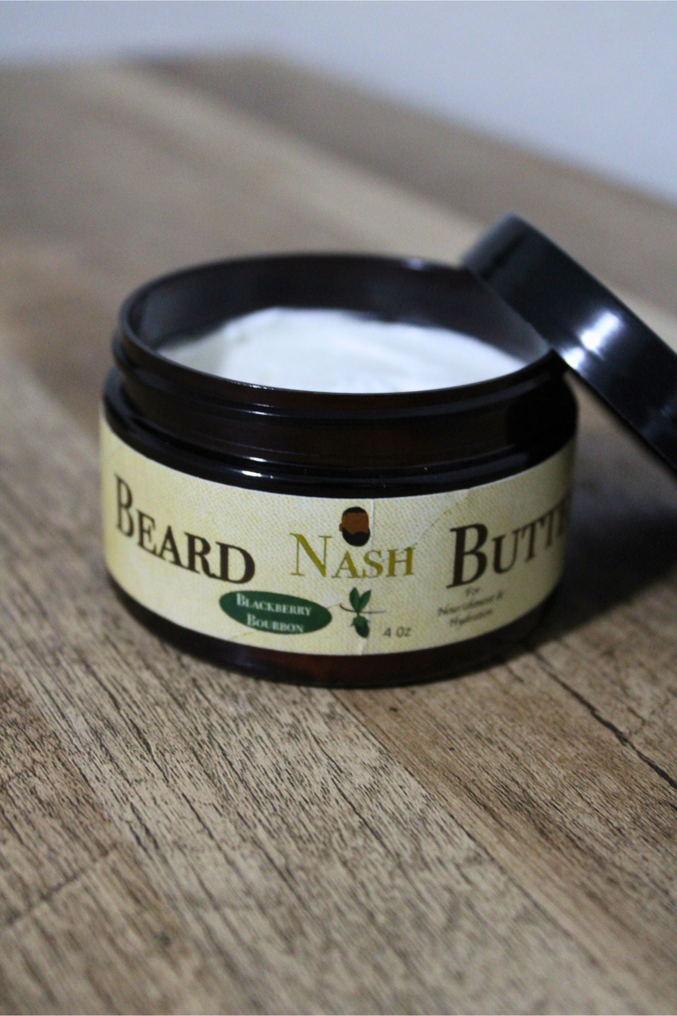 Jar of Beard Nash Butter on a wooden surface
